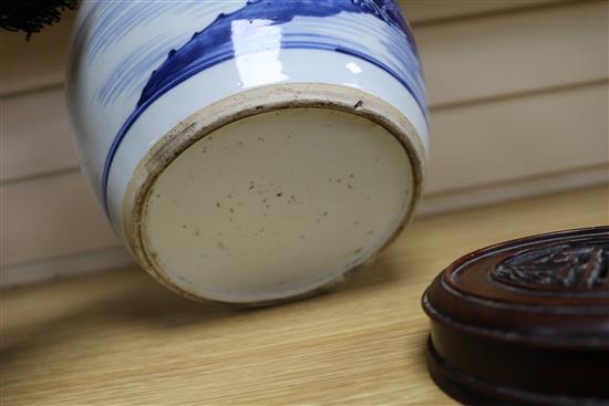 A Chinese blue and white ovoid jar, 18th century, total height 23.5cm including pierced wood cover